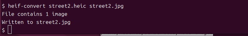 Terminal showing heif-convert command successfully converting a HEIC file to JPG
